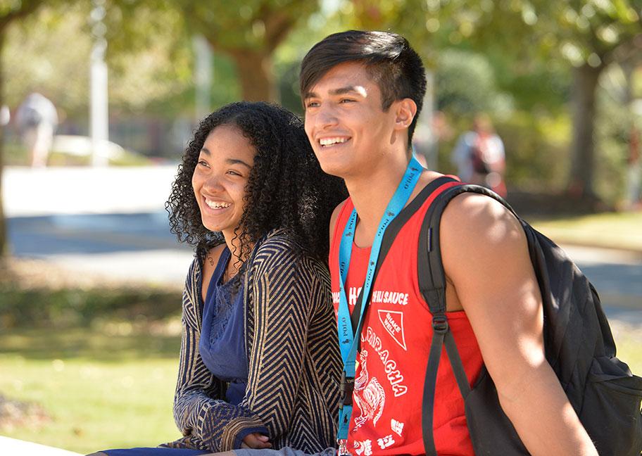 male and female students enjoying the outdoors on campus