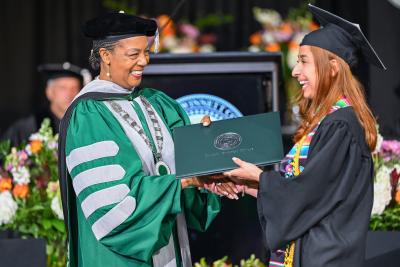 GGC grad receiving diploma from President Jann Joseph, 2024 Spring Commencement