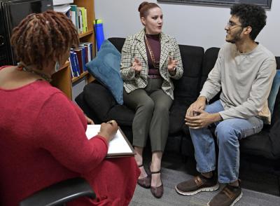 Three people talking
