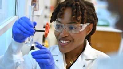 Female student looking at a test tube