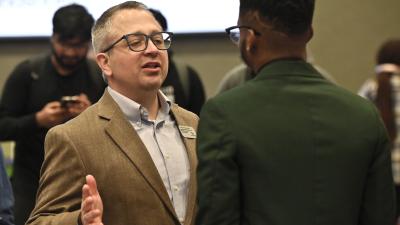 Two men talking at a hiring fair