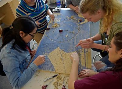 GGC students creating art through relief carving