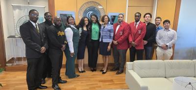 President Jann Joseph poses with student members of Georgia Gwinnett College's on-campus Greek organizations in the presidential suite