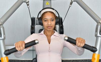 Female student working out on exercise machine in the Convocation Center WRC