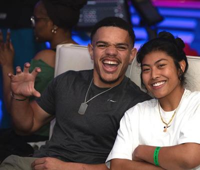GGC student gesturing with the "Grizzly Growl" during bowling event